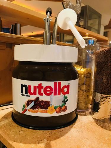 a jar of nutella sitting on top of a counter at Residence Hotel Alpinum in Campo Tures