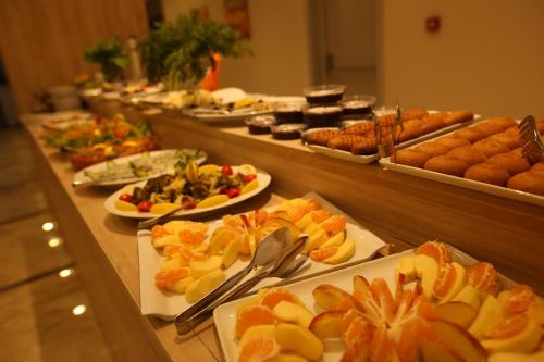 a buffet line with many different types of food at Oytun Park Hotel in Canakkale