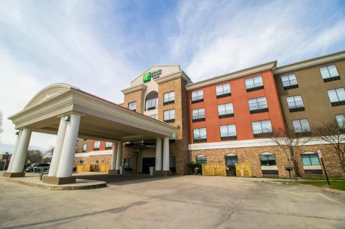 a building with a sign on top of it at Holiday Inn Express Hotel & Suites Baton Rouge -Port Allen by IHG in Port Allen