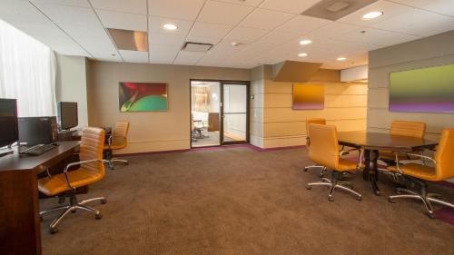 an office with a conference room with a table and chairs at Holiday Inn Downtown Rochester, an IHG Hotel in Rochester