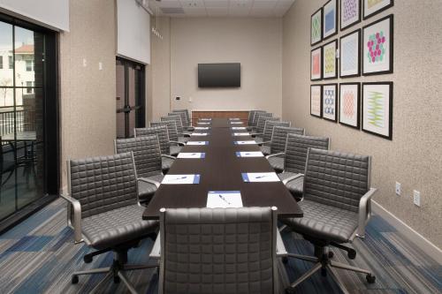 a conference room with a long table and chairs at Holiday Inn Express Pensacola Downtown by IHG in Pensacola