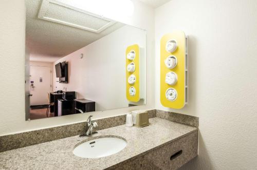 a bathroom with a sink and a mirror at Motel 6-Troutville, VA in Troutville