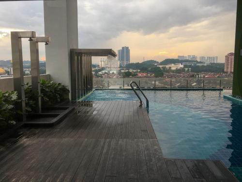 a swimming pool on the roof of a building at Zayah Homestudio near Bukit Jalil / Mines in Seri Kembangan