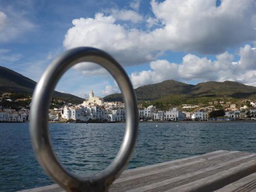 a view of a city from a boat on the water at Apartment Hibiscus Cadaqués in Cadaqués