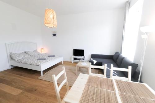 Een zitgedeelte bij Vienna Living Apartments - Hasnerstraße