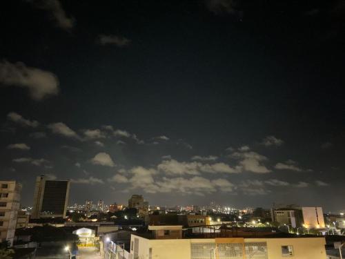 a view of a city skyline at night at Hotel Med Barranquilla Centro in Barranquilla