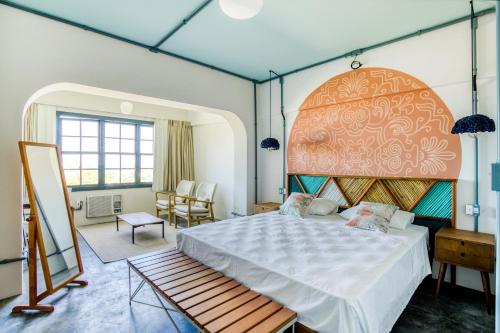 Cama ou camas em um quarto em Selina Floripa