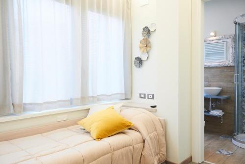 a living room with a couch and a window at Una Chicca a Roma in Rome