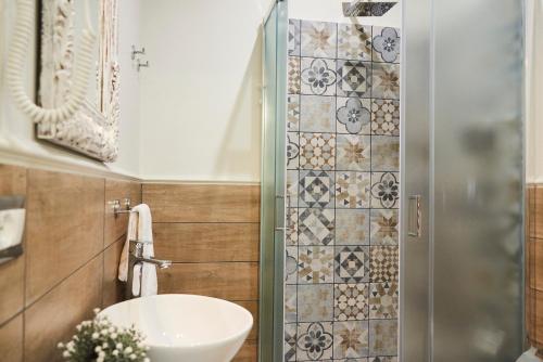 a bathroom with a sink and a shower at Una Chicca a Roma in Rome