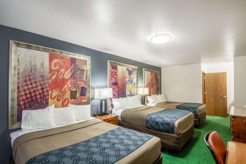 a hotel room with two beds in a room at Econo Lodge Waupaca in Waupaca