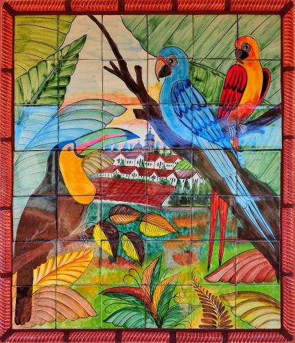 a stained glass window with three birds on a tree at Blue Seas Courtyard in Fort Lauderdale