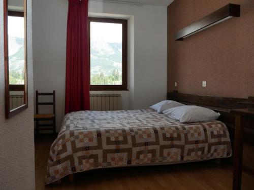 Posteľ alebo postele v izbe v ubytovaní Hotel La Portette