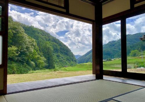 a view from a window of a mountain view at Setouchi Cominca Stays Hiroshima furousen / Vacation STAY 64497 in Shōbara