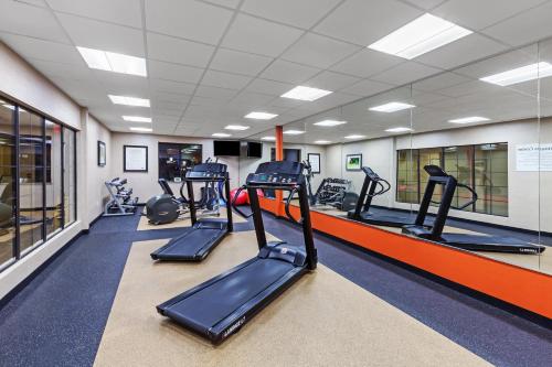 a gym with treadmills and elliptical machines at Holiday Inn Express & Suites Houston East by IHG in Houston