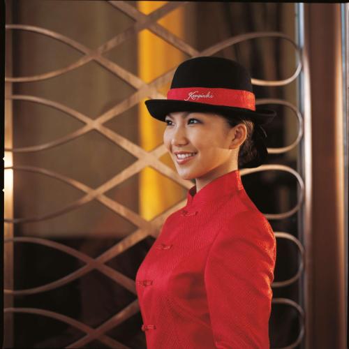 a woman wearing a red dress and a black hat at Kempinski Hotel Shenzhen - 24 Hours Stay Privilege, Subject to Hotel Inventory in Shenzhen