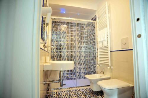 a bathroom with a sink and a toilet at Matteo's House B&b in Amalfi
