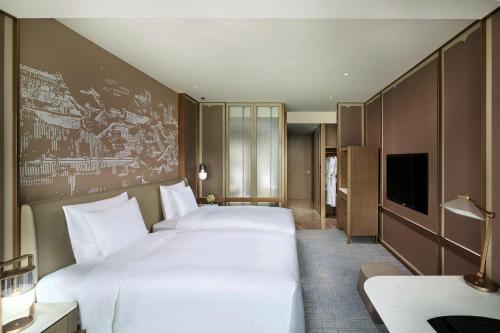 Kempinski Hotel Nanjingにあるベッド