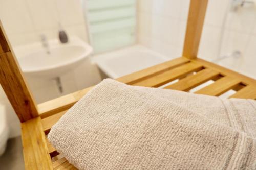 a bathroom with a shower and a sink and a towel at City Flair in Dresden