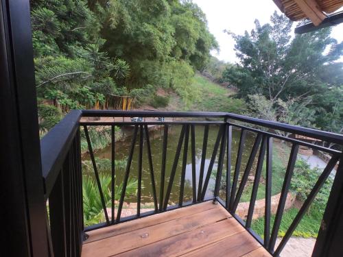 a balcony with a view of a river at Hotel Casas de Campo El Ciruelo in San Gil