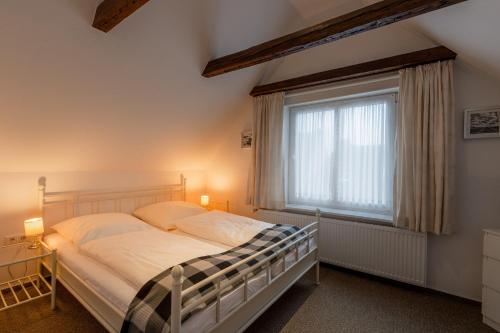 Postel nebo postele na pokoji v ubytování stadthaus husum