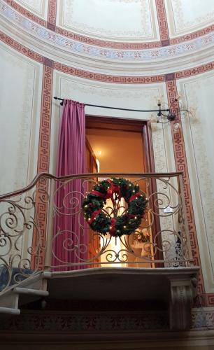a christmas wreath on a staircase in a building at L'Americano Luxury Rooms in Chiavari