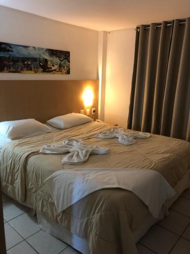 Postel nebo postele na pokoji v ubytování Pipas Ocean Vista Mar e Piscina