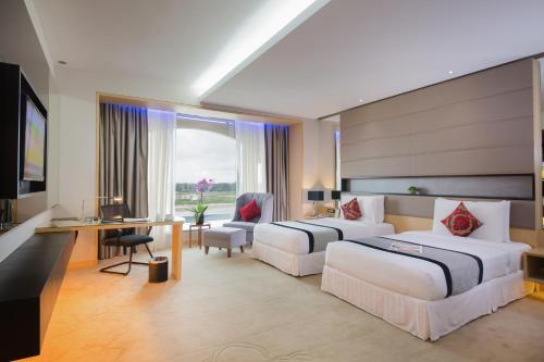 Кровать или кровати в номере Ancasa Royale, Pekan Pahang by Ancasa Hotels & Resorts