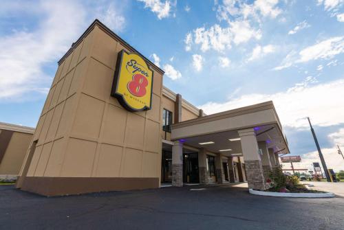a building with a sign on the side of it at Super 8 by Wyndham Goldsboro in Goldsboro