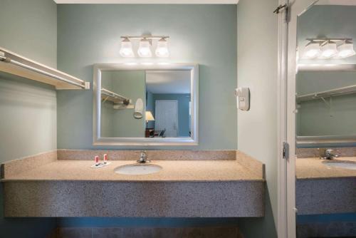 A bathroom at Travelodge by Wyndham Santee