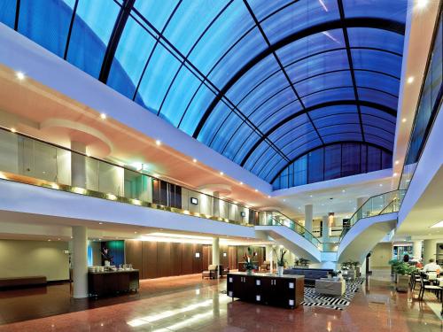a large building with a large glass ceiling at Novotel Sydney Parramatta in Sydney