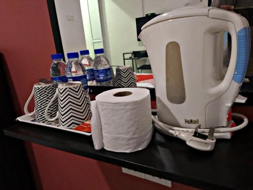 a mixer on a counter with a roll of paper towels at Pengkalan Dua in Melaka