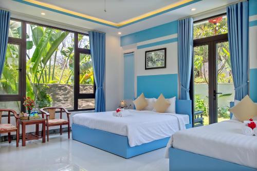 Giường trong phòng chung tại An Bang River Lake Villa