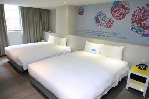 Ένα ή περισσότερα κρεβάτια σε δωμάτιο στο Wholesome Hotel