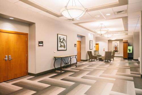 a hallway of a hospital with a table and chairs at Crowne Plaza Hotel Harrisburg-Hershey by IHG in Harrisburg
