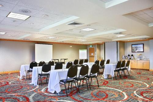 a conference room with tables and chairs in it at Comfort Suites Boise West Meridian in Meridian