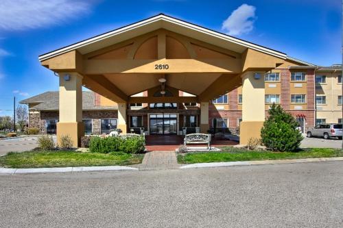 a hotel building with a large building at Comfort Suites Boise West Meridian in Meridian