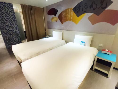 Ένα ή περισσότερα κρεβάτια σε δωμάτιο στο Wholesome Hotel