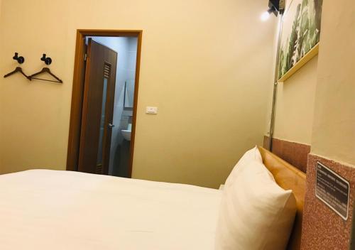 Postel nebo postele na pokoji v ubytování Chia Kon Hotel