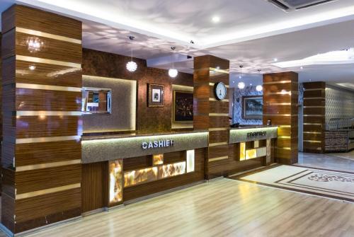 a bowling alley with a wooden wall at Formback Thermal Suit & Apart in Bursa