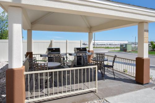 a pavilion with tables and chairs and a grill at Candlewood Suites Cheyenne by IHG in Cheyenne
