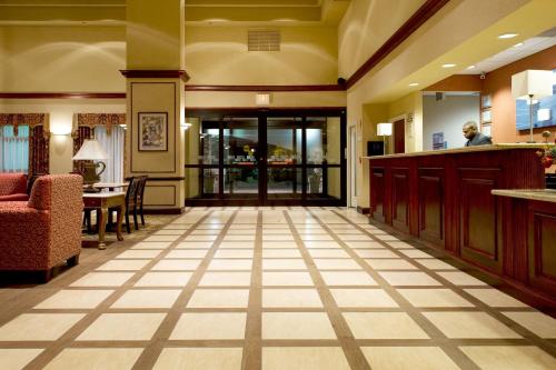 a lobby with a waiting area and a lobby at Holiday Inn Express Hotel & Suites Dallas Fort Worth Airport South, an IHG Hotel in Irving