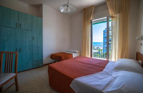 Postel nebo postele na pokoji v ubytování Hotel Sayonara