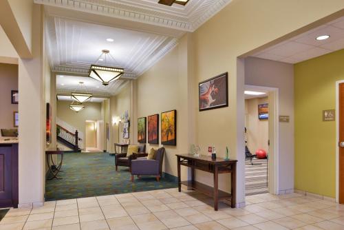 a lobby of a hospital with chairs and a table at Candlewood Suites Terre Haute by IHG in Terre Haute