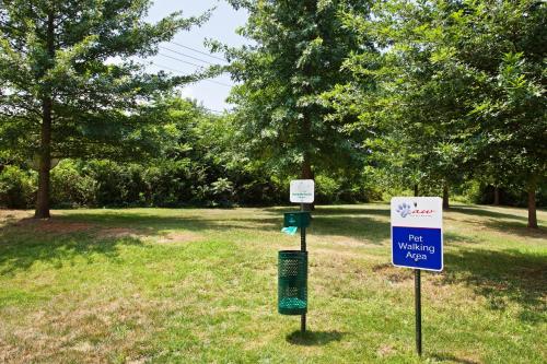 a park with two signs in the grass at Candlewood Suites Knoxville Airport-Alcoa by IHG in Alcoa