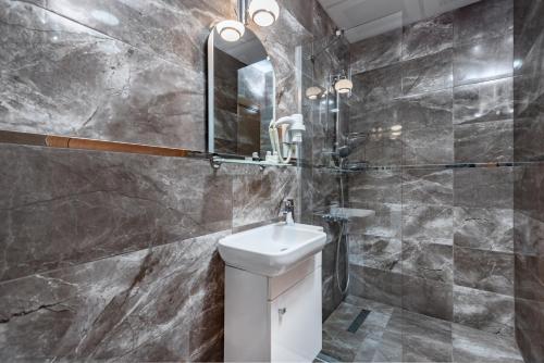 a bathroom with a sink and a mirror at OASIS SUITES OLD CITY in Istanbul