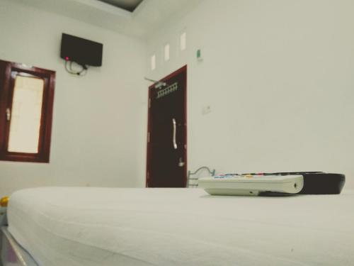 Una televisión o centro de entretenimiento en Wisma Aira