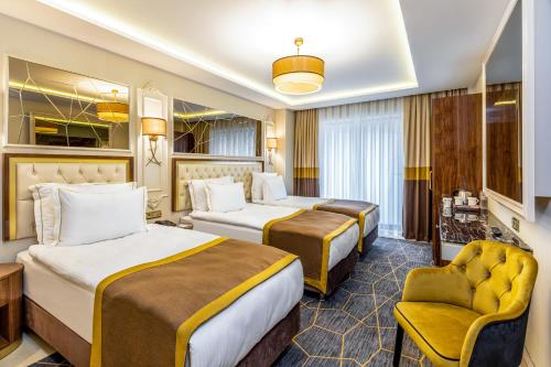 Postel nebo postele na pokoji v ubytování Beethoven Senfoni Hotel