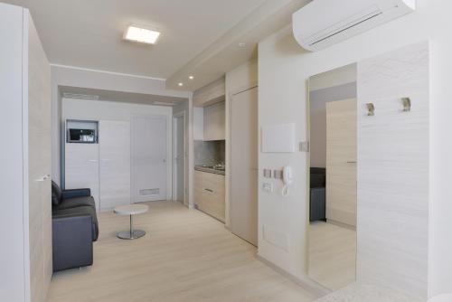 a living room with a couch and a table at Residence Picalè in Alghero