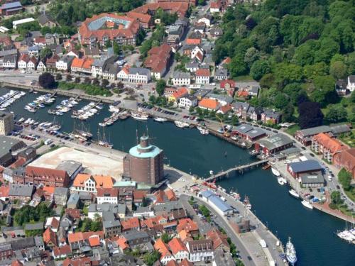 an aerial view of a town with boats in a harbor at Ferienwohnung in Damp Residenzblick an der Ostsee in Damp