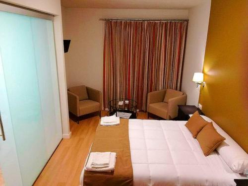 Ένα ή περισσότερα κρεβάτια σε δωμάτιο στο Hotel Moya